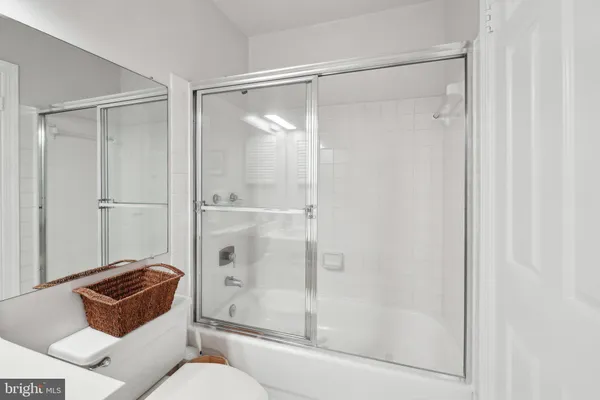a bathroom with a shower and a toilet