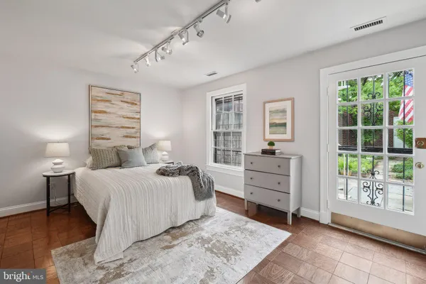 a bed room with a bed and a window
