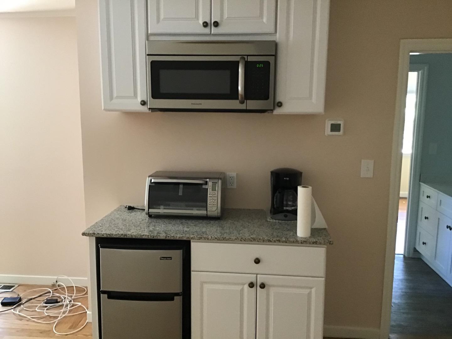 650 Whiskey Hill Road, Unit INLAW Woodside, CA 94062 - Photo 3 of 8 a kitchen with stainless steel appliances granite countertop a stove microwave and sink