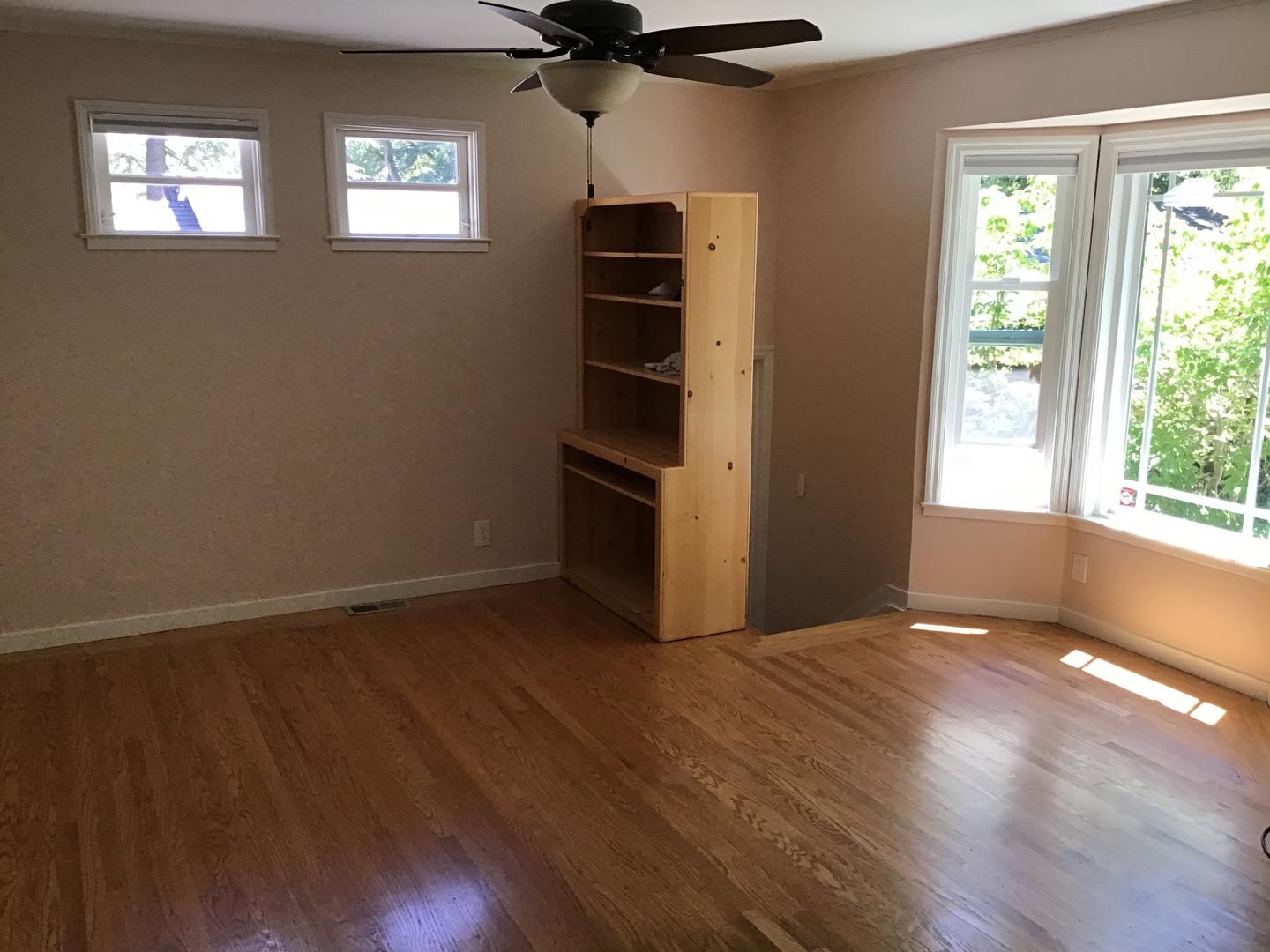 650 Whiskey Hill Road, Unit INLAW Woodside, CA 94062 - Photo 4 of 8 a view of an empty room with a window and wooden floor