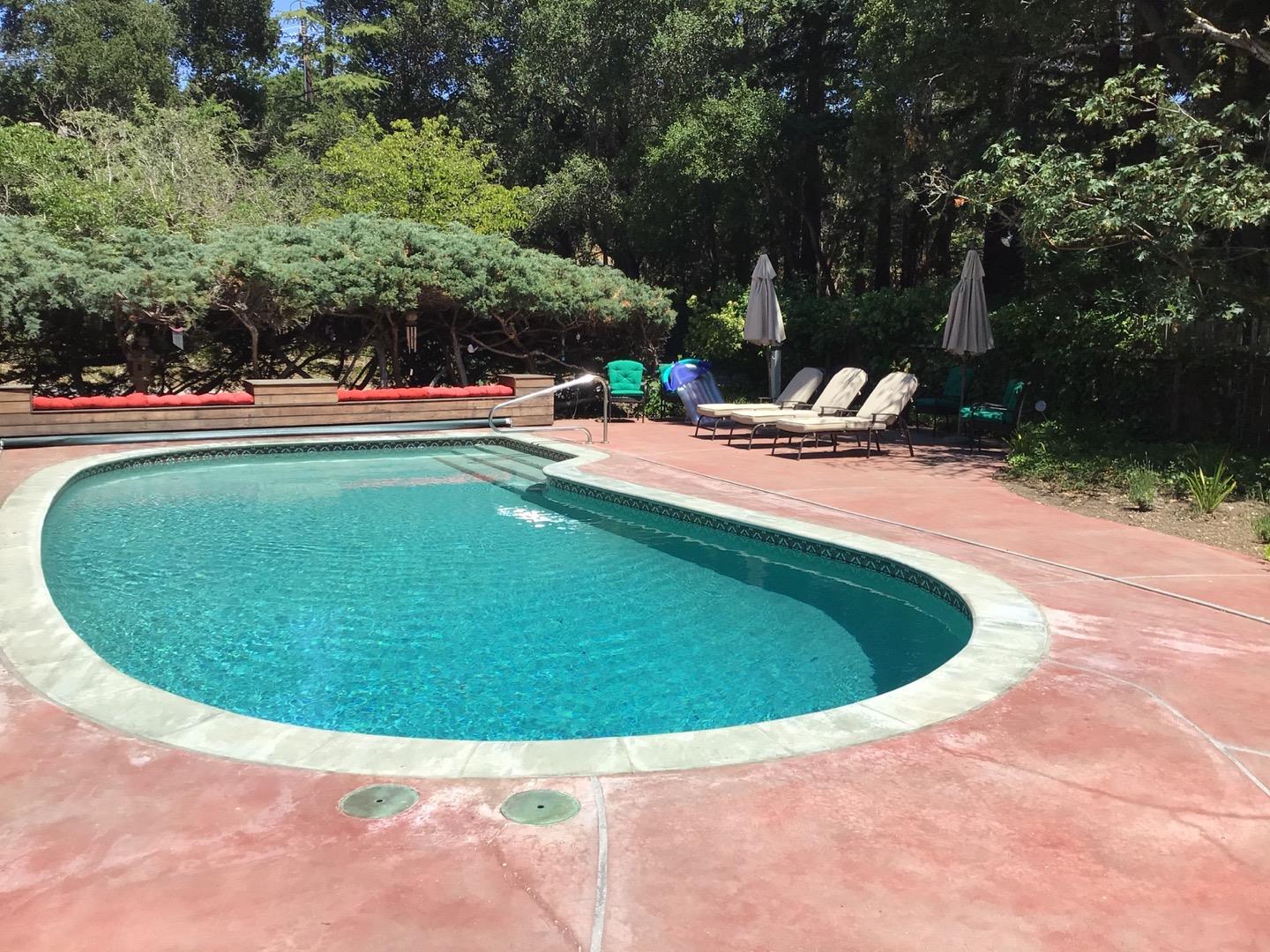 650 Whiskey Hill Road, Unit INLAW Woodside, CA 94062 - Photo 8 of 8 a view of a swimming pool with an outdoor space and seating area