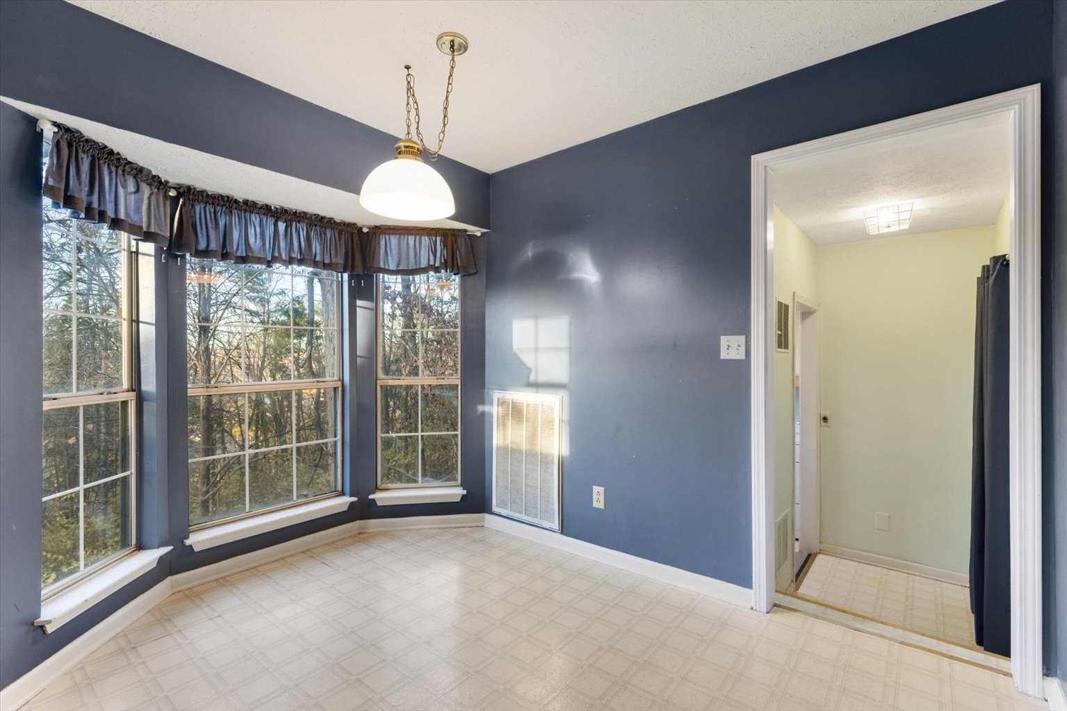 853 Bishopsgate Road Antioch, TN 37013 - Photo 8 of 41 a view of a room with a large window and chandelier