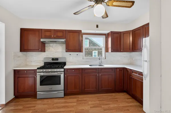 a kitchen with a stove and a sink