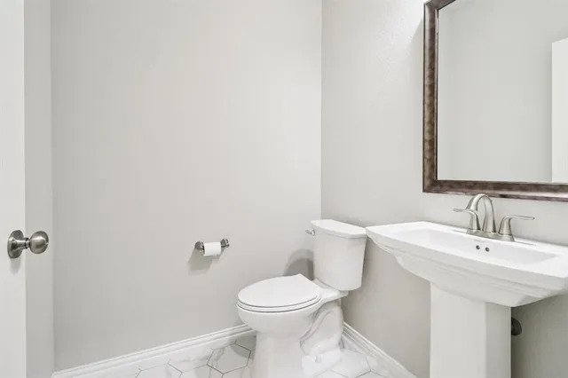 a bathroom with a sink and a toilet