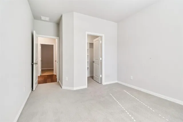 a view of an empty room and closet