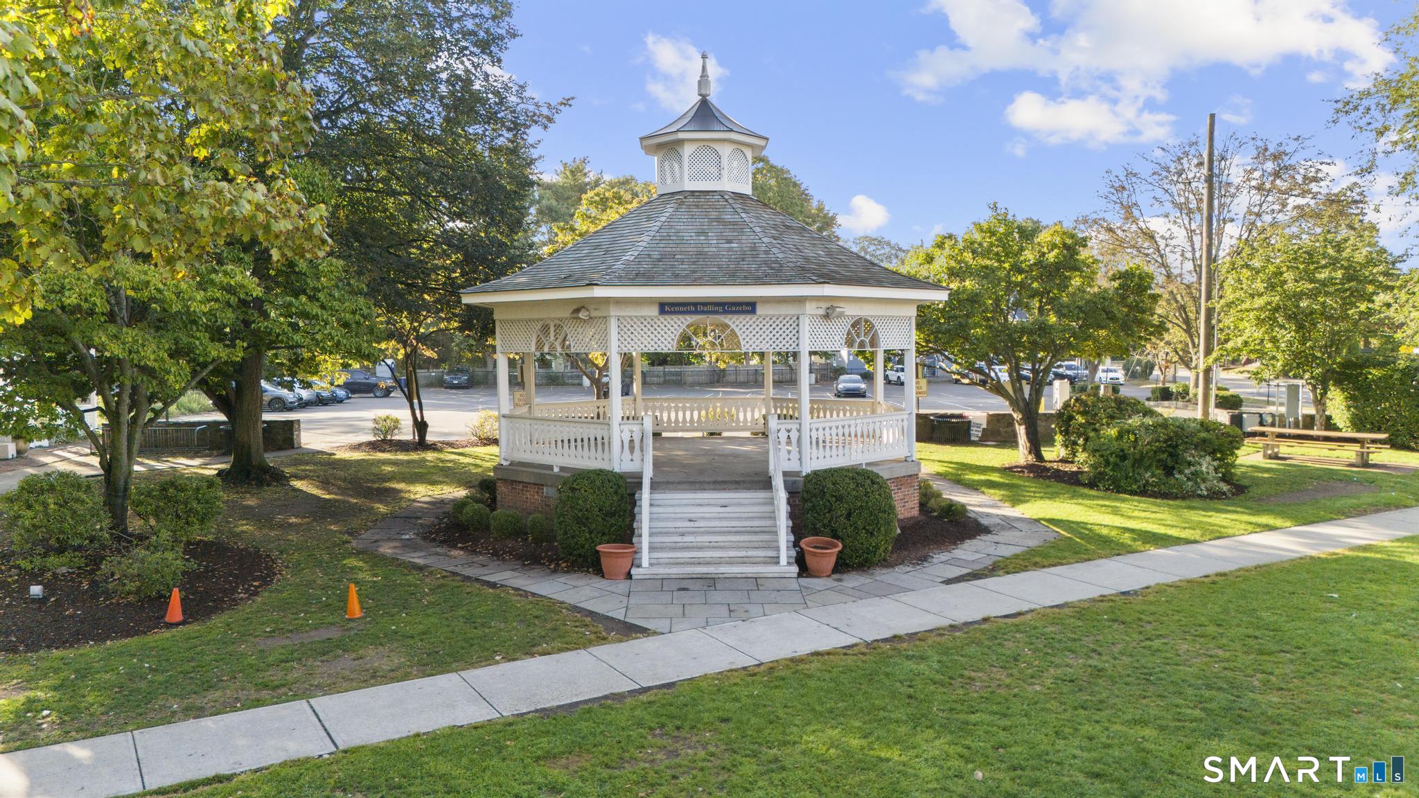 391 Reef Road, Unit 1A Fairfield, CT 06824 - Photo 18 of 24 a front view of house with yard and green space