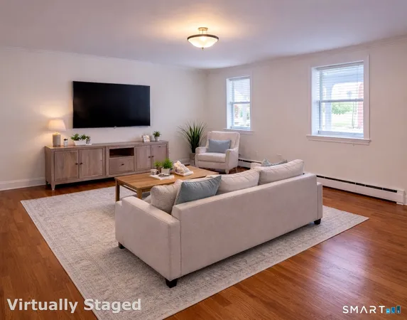 a living room with furniture and a flat screen tv