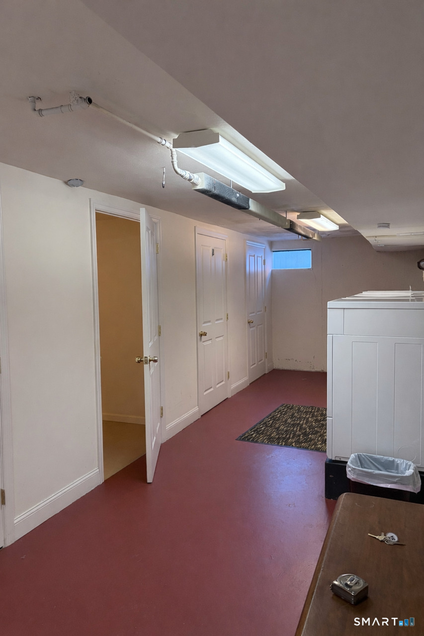 391 Reef Road, Unit 1A Fairfield, CT 06824 - Photo 22 of 24 a view of a storage & utility room