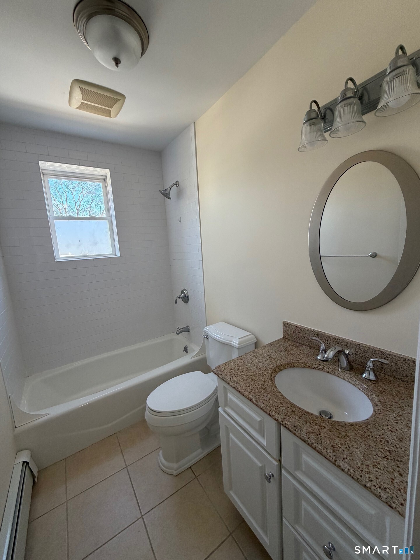 391 Reef Road, Unit 1A Fairfield, CT 06824 - Photo 10 of 24 a bathroom with a granite countertop sink and a mirror