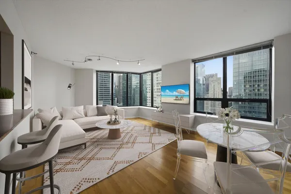 a living room with furniture and a large window