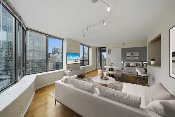 a living room with furniture and a large window