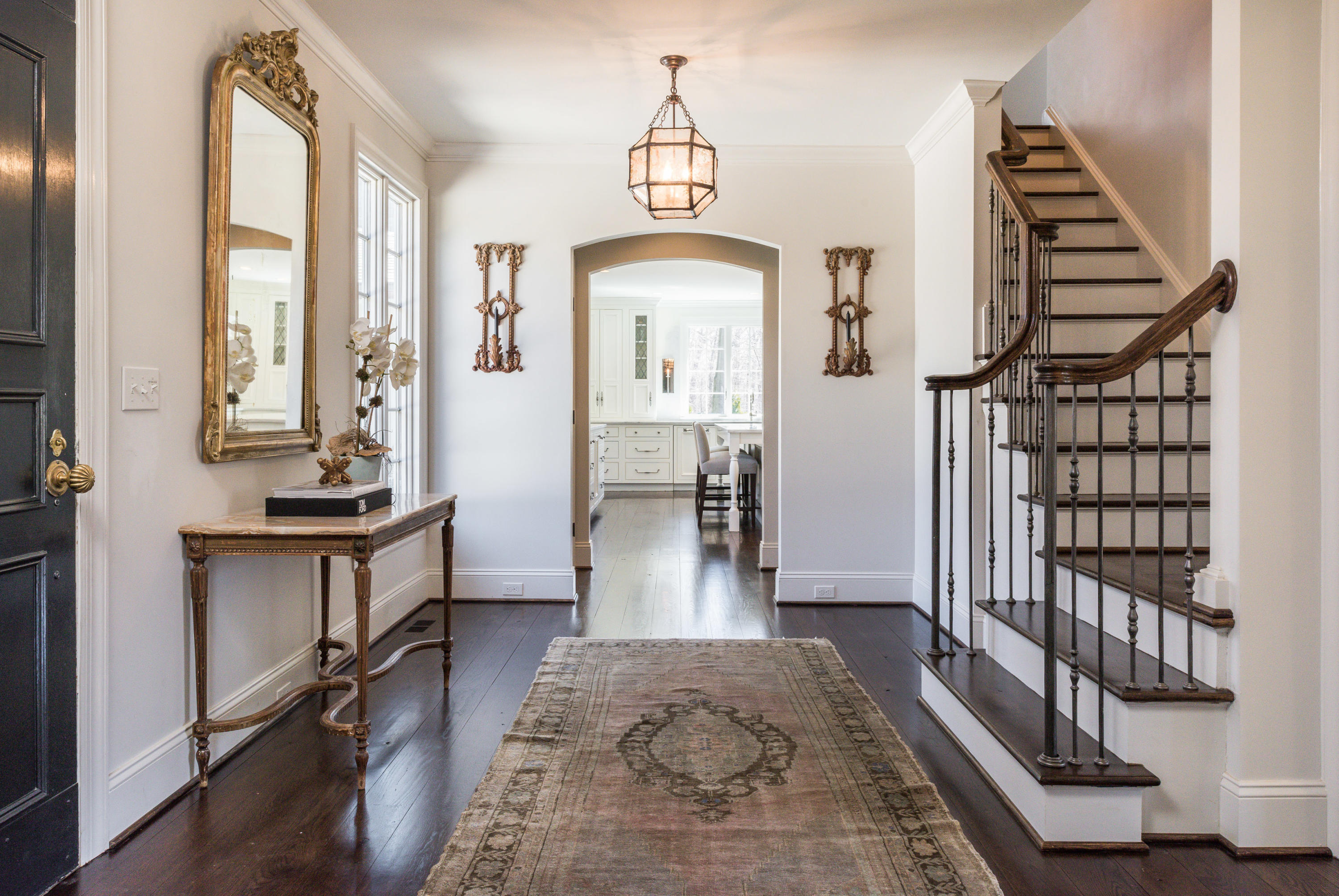15 Indian Spring Trail Darien, CT 06820 - Photo 12 of 37 a view of a hallway with wooden floor and staircase