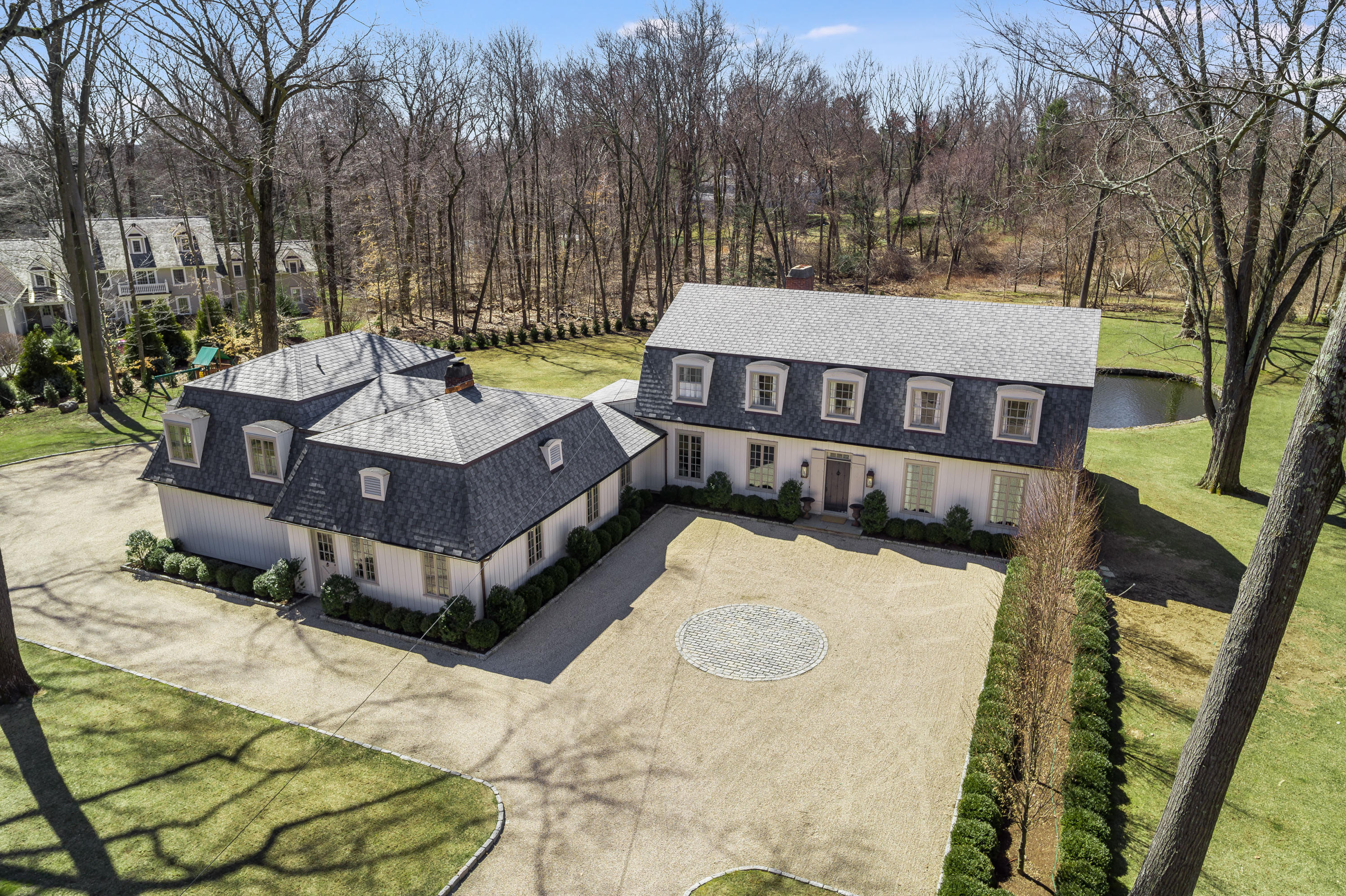 15 Indian Spring Trail Darien, CT 06820 - Photo 2 of 37 a view of a roof deck with wooden fence and a couple of chairs