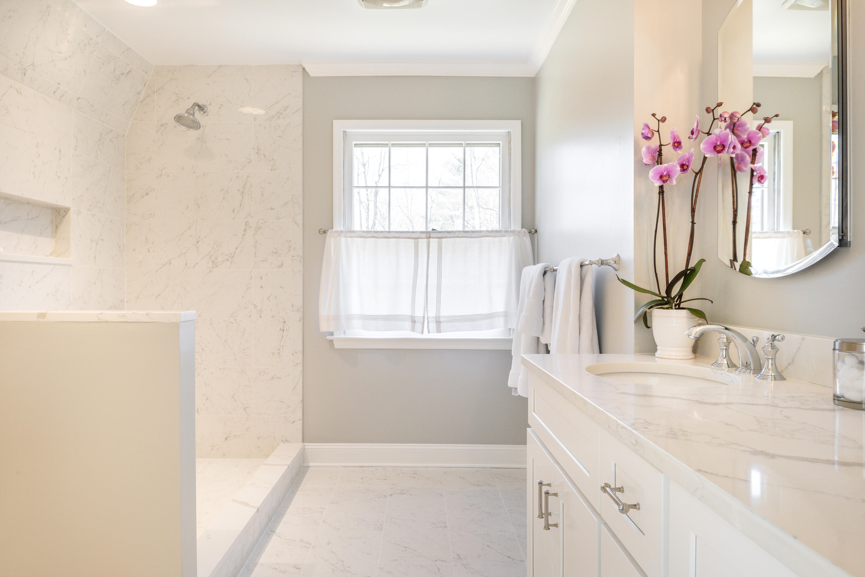 15 Indian Spring Trail Darien, CT 06820 - Photo 25 of 37 a bathroom with a sink vanity tub and shower