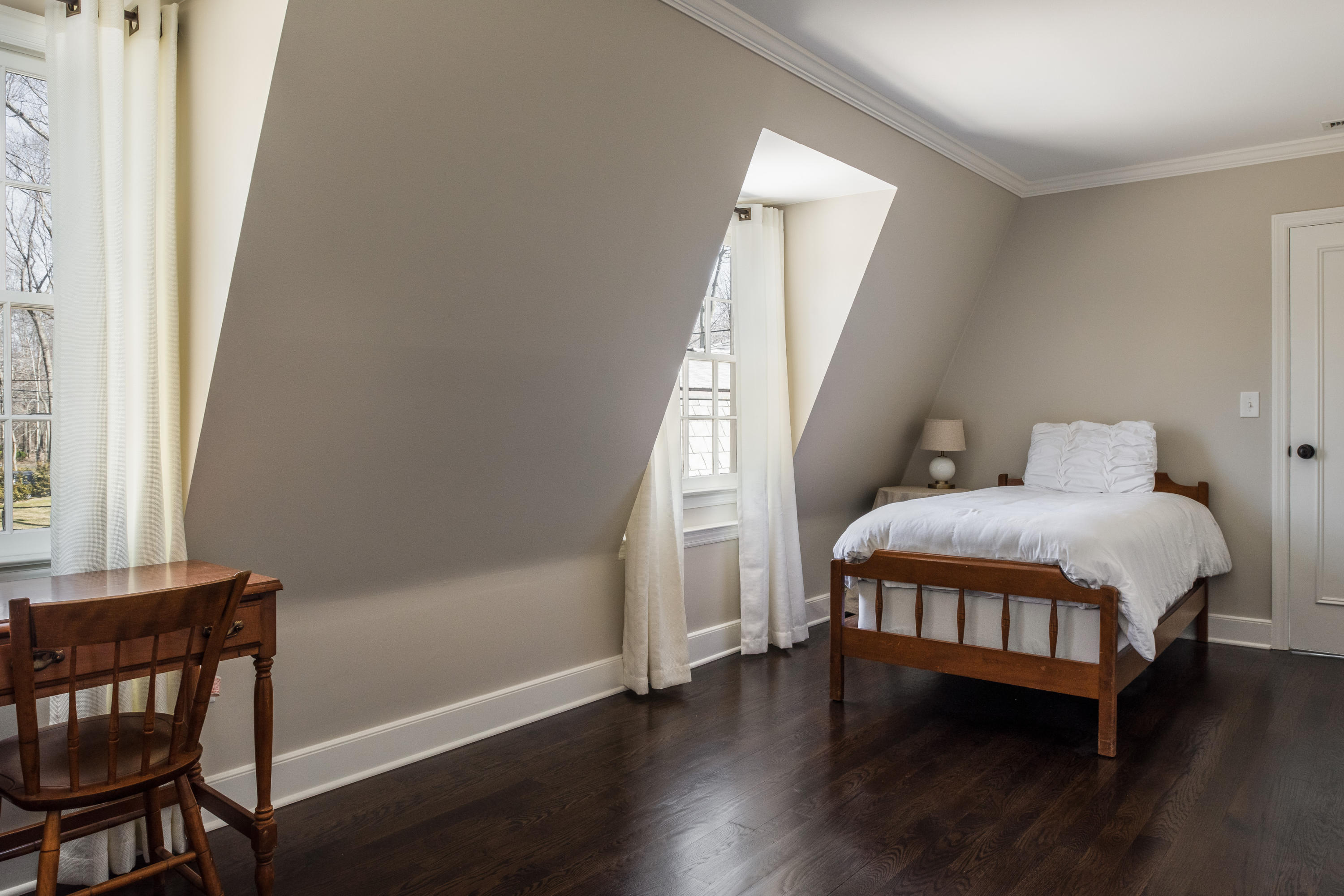 15 Indian Spring Trail Darien, CT 06820 - Photo 29 of 37 a bedroom with a bed window and wooden floor