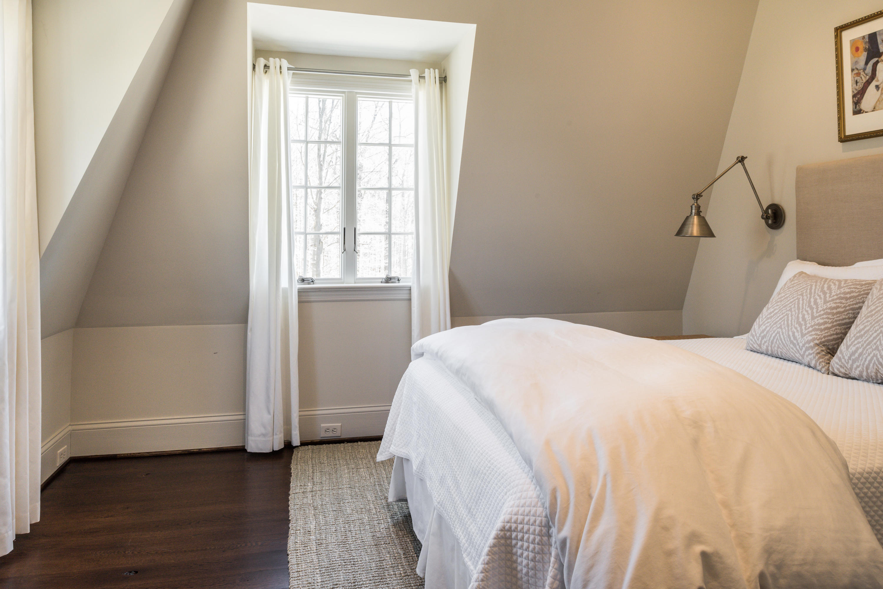 15 Indian Spring Trail Darien, CT 06820 - Photo 32 of 37 a bedroom with a bed and wooden floor