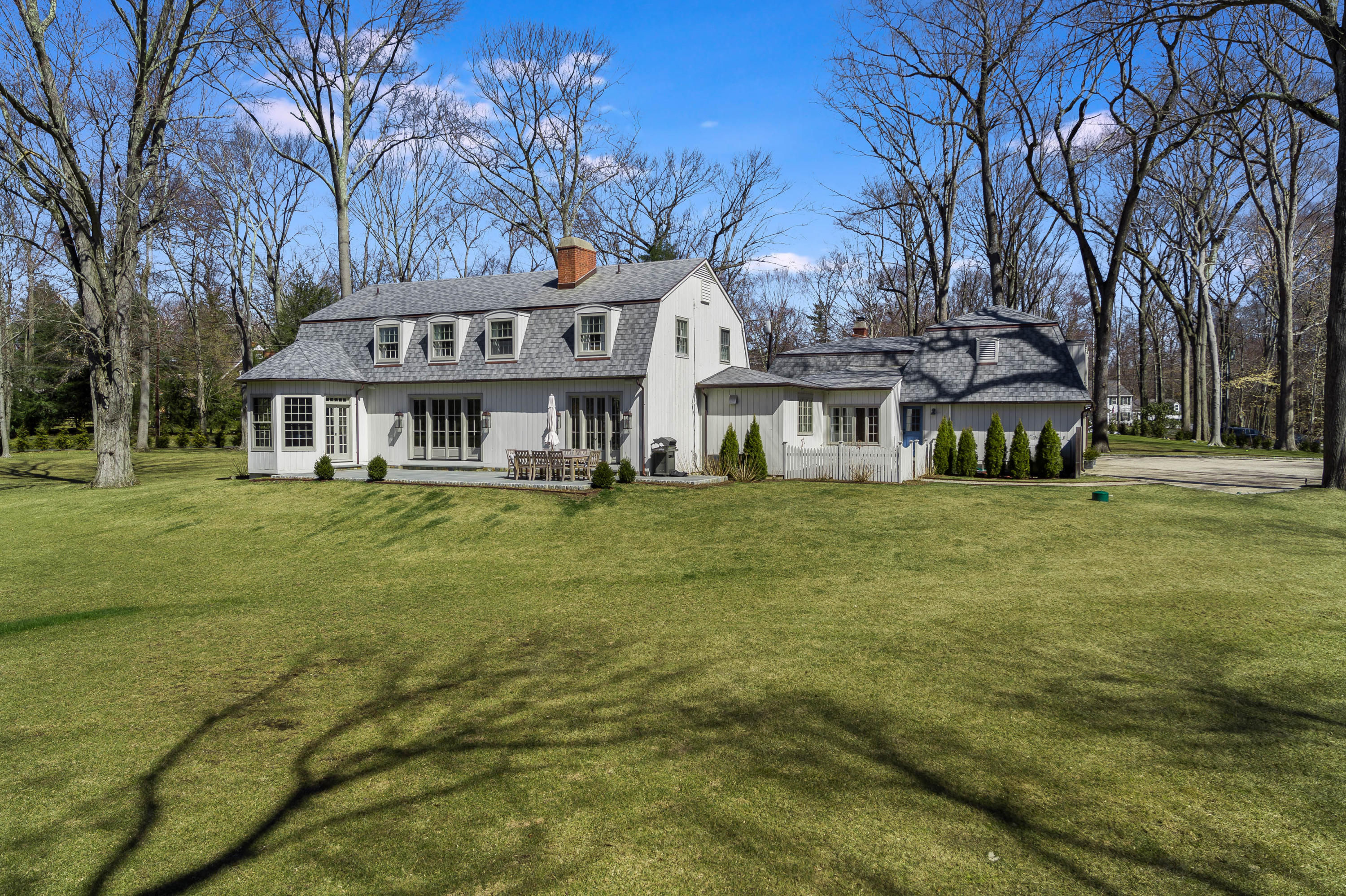 15 Indian Spring Trail Darien, CT 06820 - Photo 9 of 37 a front view of a building with garden