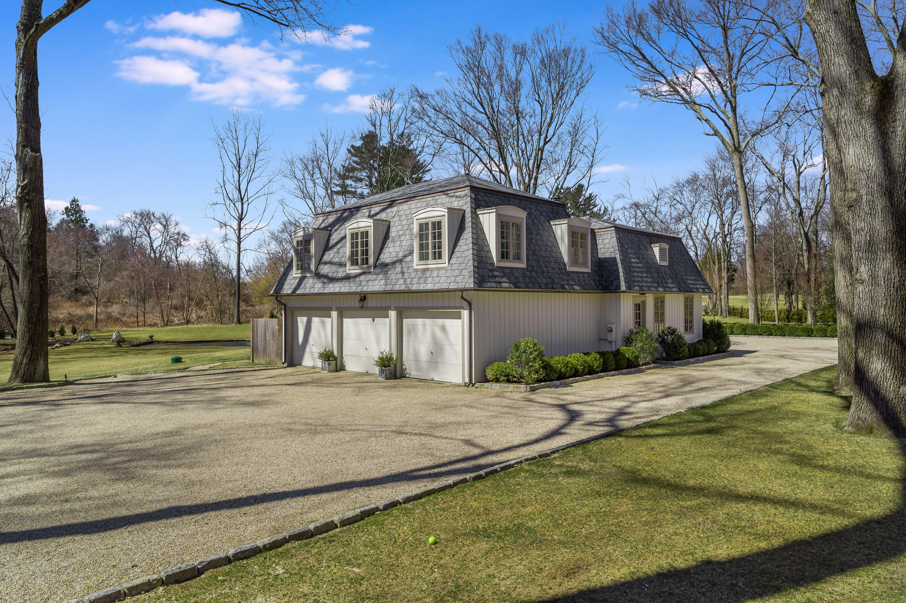 15 Indian Spring Trail Darien, CT 06820 - Photo 10 of 37 a front view of a house with a yard