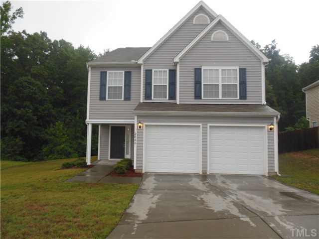 2046 Spring Creek Drive Durham, NC 27704 - Photo 1 of 10 a front view of a house with garden