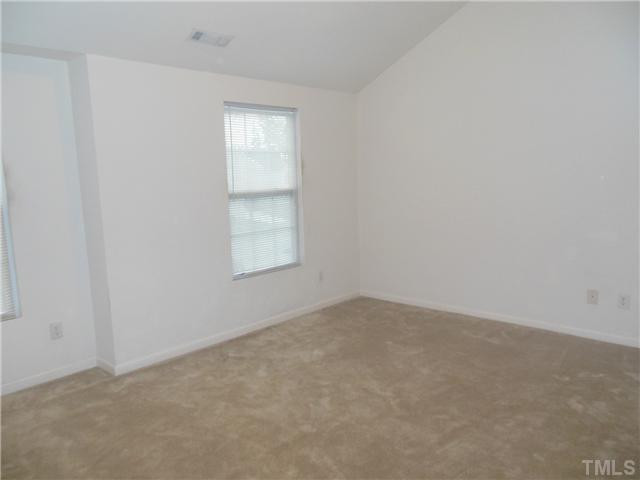 2046 Spring Creek Drive Durham, NC 27704 - Photo 7 of 10 an empty room with windows
