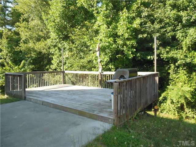 2046 Spring Creek Drive Durham, NC 27704 - Photo 9 of 10 a view of a wooden fence and trees