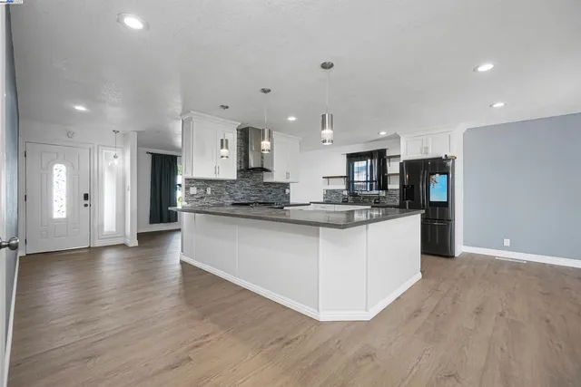 a view of kitchen with wooden floor