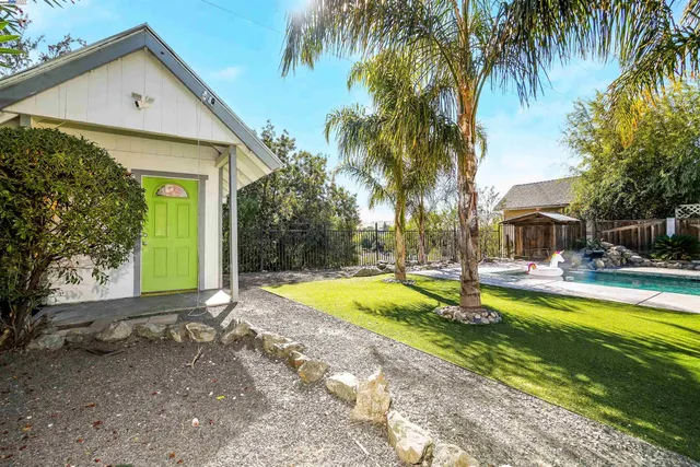 a front view of a house with swimming pool
