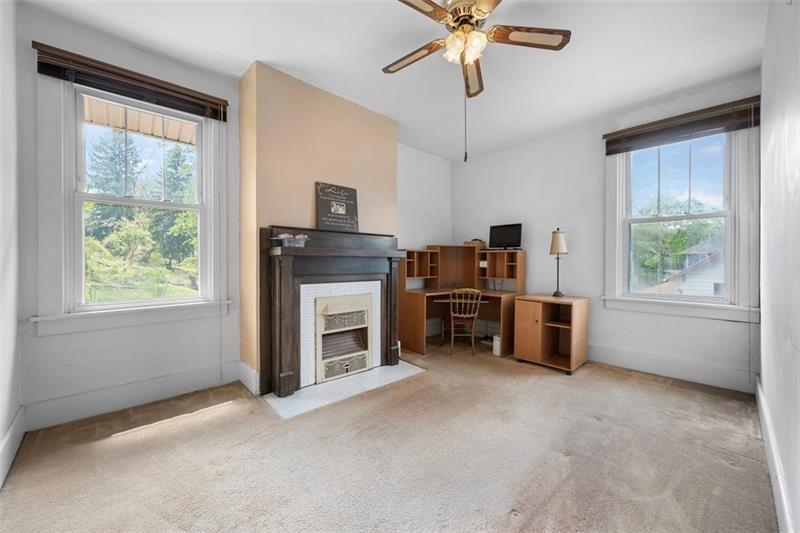 508 Cascade Road Pittsburgh, PA 15221 - Photo 20 of 37 a view of a livingroom with furniture and a fireplace