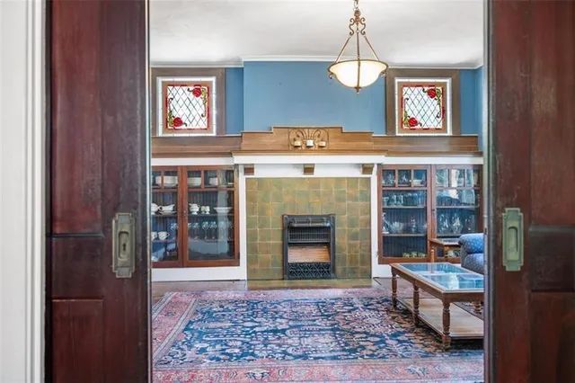 a living room with furniture and a fireplace