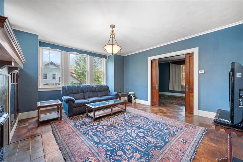 508 Cascade Road Pittsburgh, PA 15221 - Photo 10 of 37 a living room with furniture rug and window
