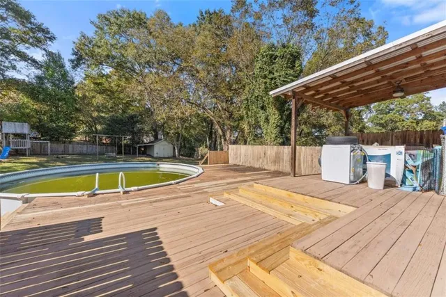 a view of a swimming pool with a patio