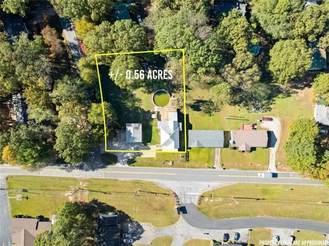 a swimming pool with trees in the background