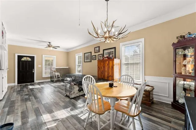 a view of a livingroom with furniture window and wooden floor