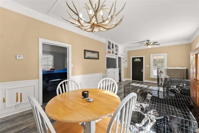 a view of a dining room with furniture window and wooden floor