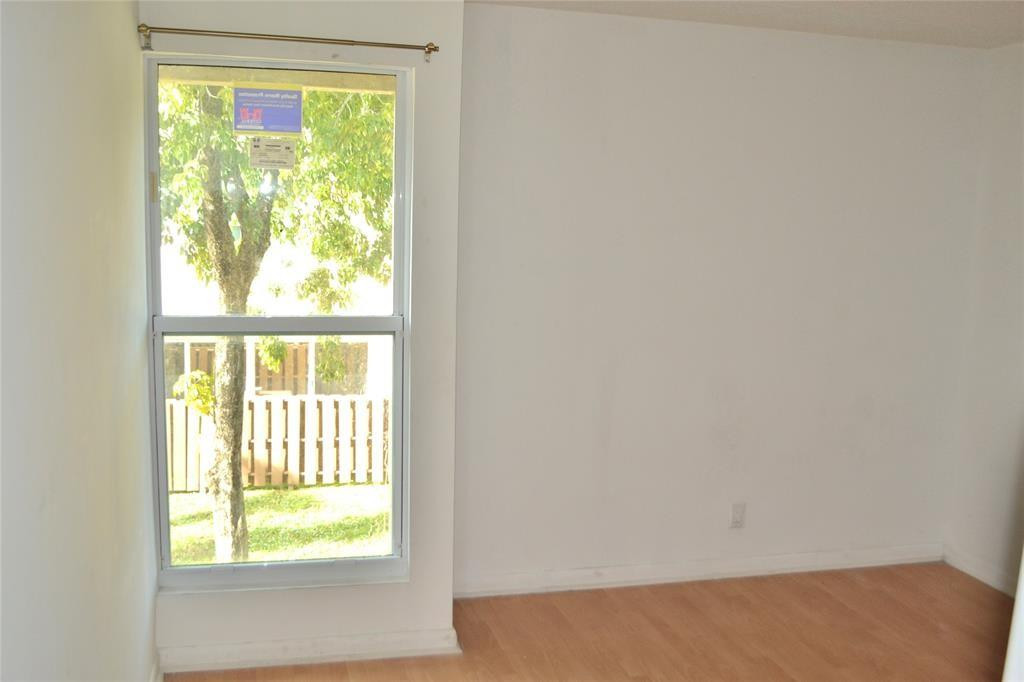 8237 Northwest 8th Court, Unit 4 Plantation, FL 33324 - Photo 11 of 24 a view of an empty room and window