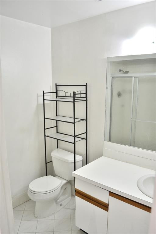 8237 Northwest 8th Court, Unit 4 Plantation, FL 33324 - Photo 12 of 24 a bathroom with a toilet a sink and mirror