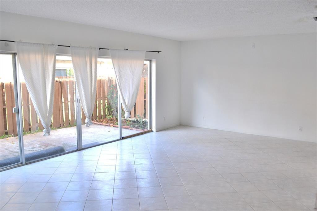 8237 Northwest 8th Court, Unit 4 Plantation, FL 33324 - Photo 15 of 24 a view of an empty room and window