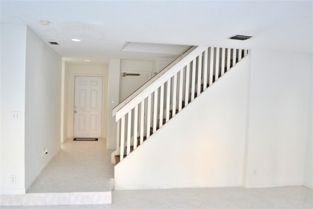 8237 Northwest 8th Court, Unit 4 Plantation, FL 33324 - Photo 17 of 24 a view of a hallway with staircase
