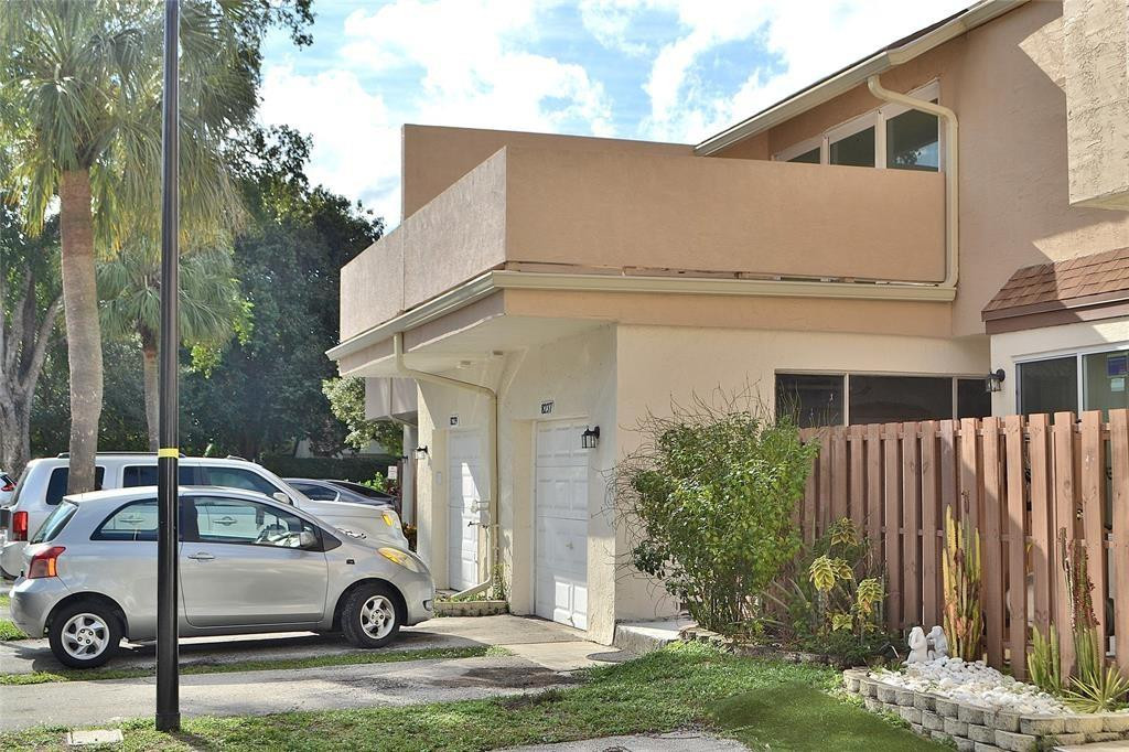 8237 Northwest 8th Court, Unit 4 Plantation, FL 33324 - Photo 19 of 24 a view of a car parked in front of a house