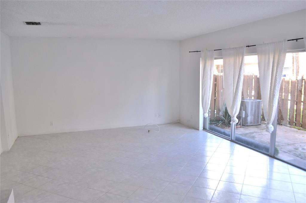 8237 Northwest 8th Court, Unit 4 Plantation, FL 33324 - Photo 2 of 24 a view of an empty room and window