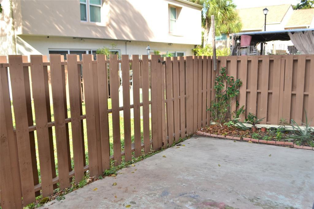 8237 Northwest 8th Court, Unit 4 Plantation, FL 33324 - Photo 21 of 24 a view of a wooden fence with a wooden fence