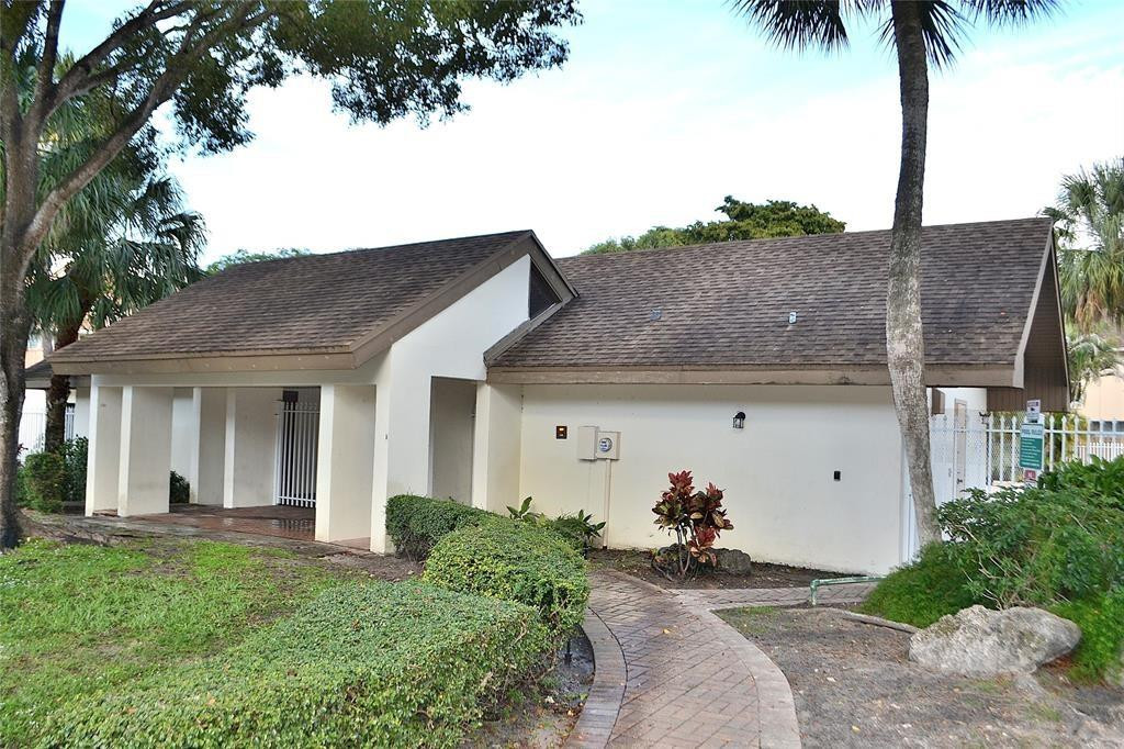 8237 Northwest 8th Court, Unit 4 Plantation, FL 33324 - Photo 22 of 24 a view of a house and a yard