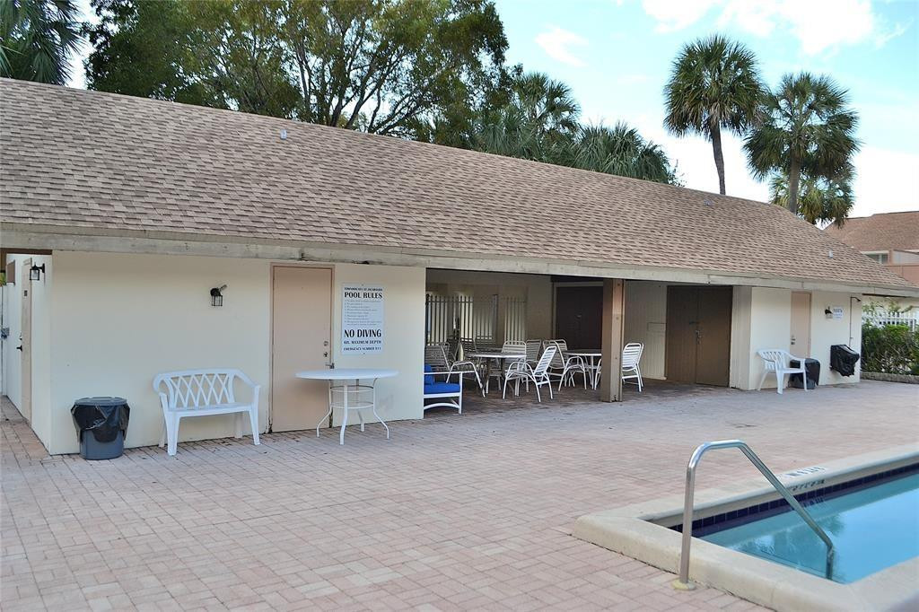 8237 Northwest 8th Court, Unit 4 Plantation, FL 33324 - Photo 24 of 24 a view of a chairs and tables in patio