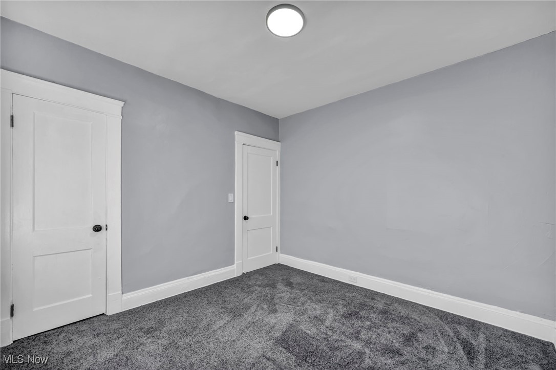 10112 Kinsman Road Cleveland, OH 44104 - Photo 18 of 49 Unfurnished room featuring baseboards and carpet flooring