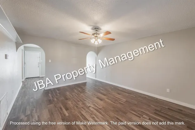 a kitchen with stainless steel appliances granite countertop a stove a sink and a white cabinets