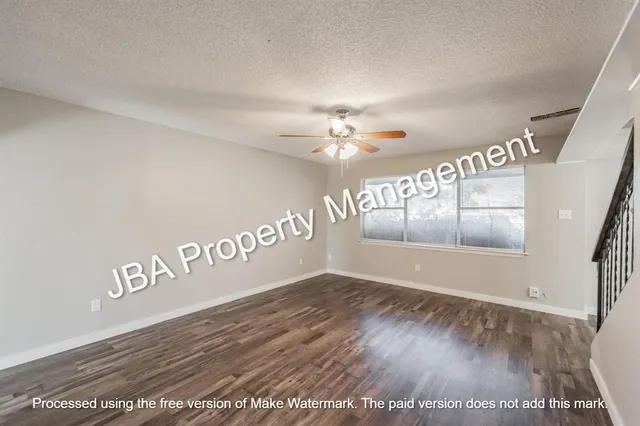 a kitchen with granite countertop a stove and a sink