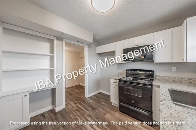 a view of a livingroom with wooden floor