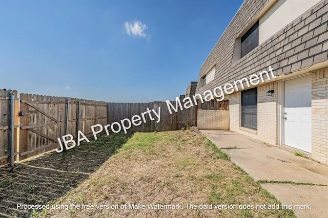 a view of a hallway with stairs