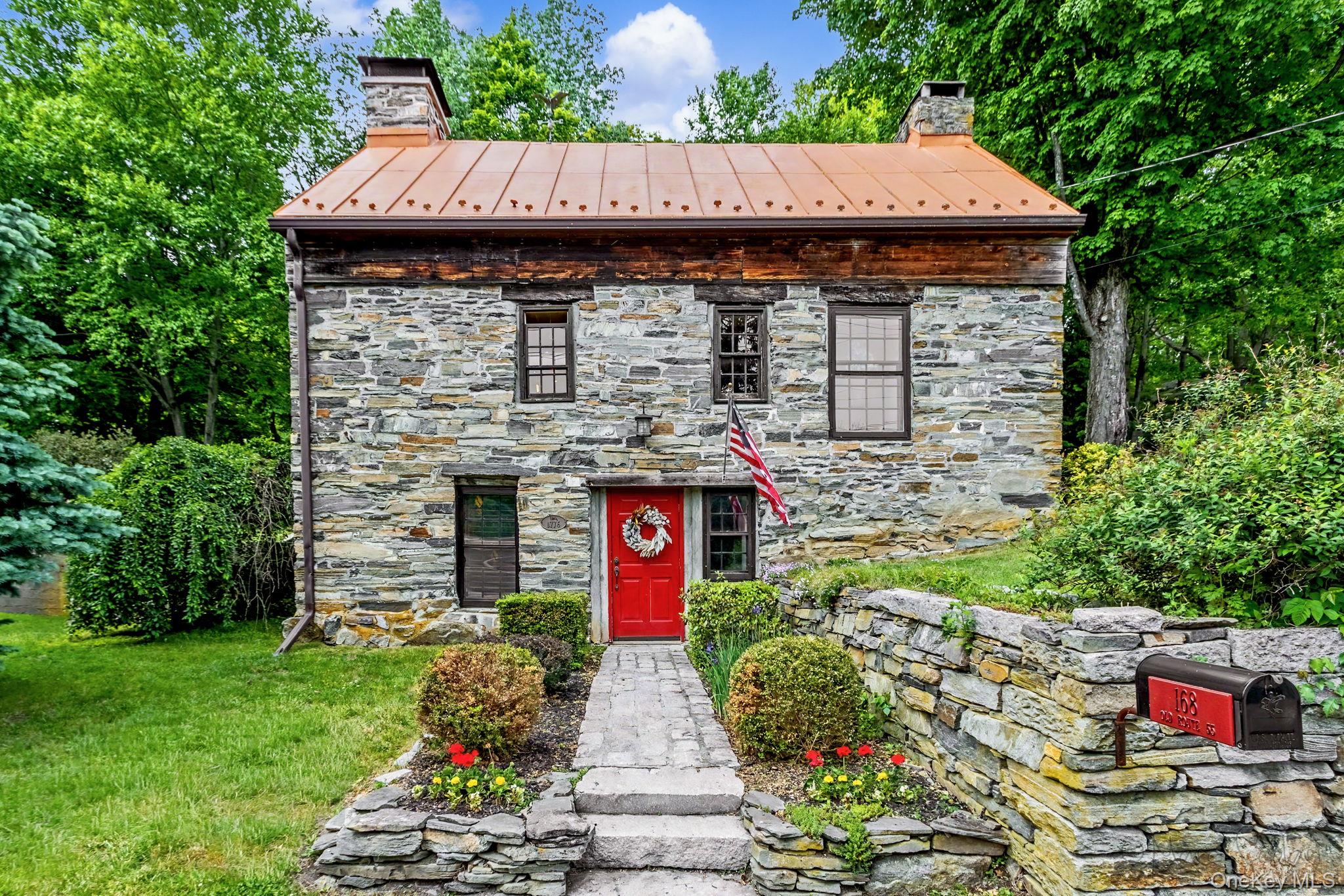 168 Old Rte 55 Pawling, NY 12564 - Photo 1 of 43 a front view of a house with a garden