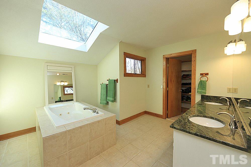 11716 Appaloosa Run East Raleigh, NC 27613 - Photo 12 of 30 Large master bath with whirlpool tub, separate shower, dual granite counter vanity. Large closet size is sure to please!